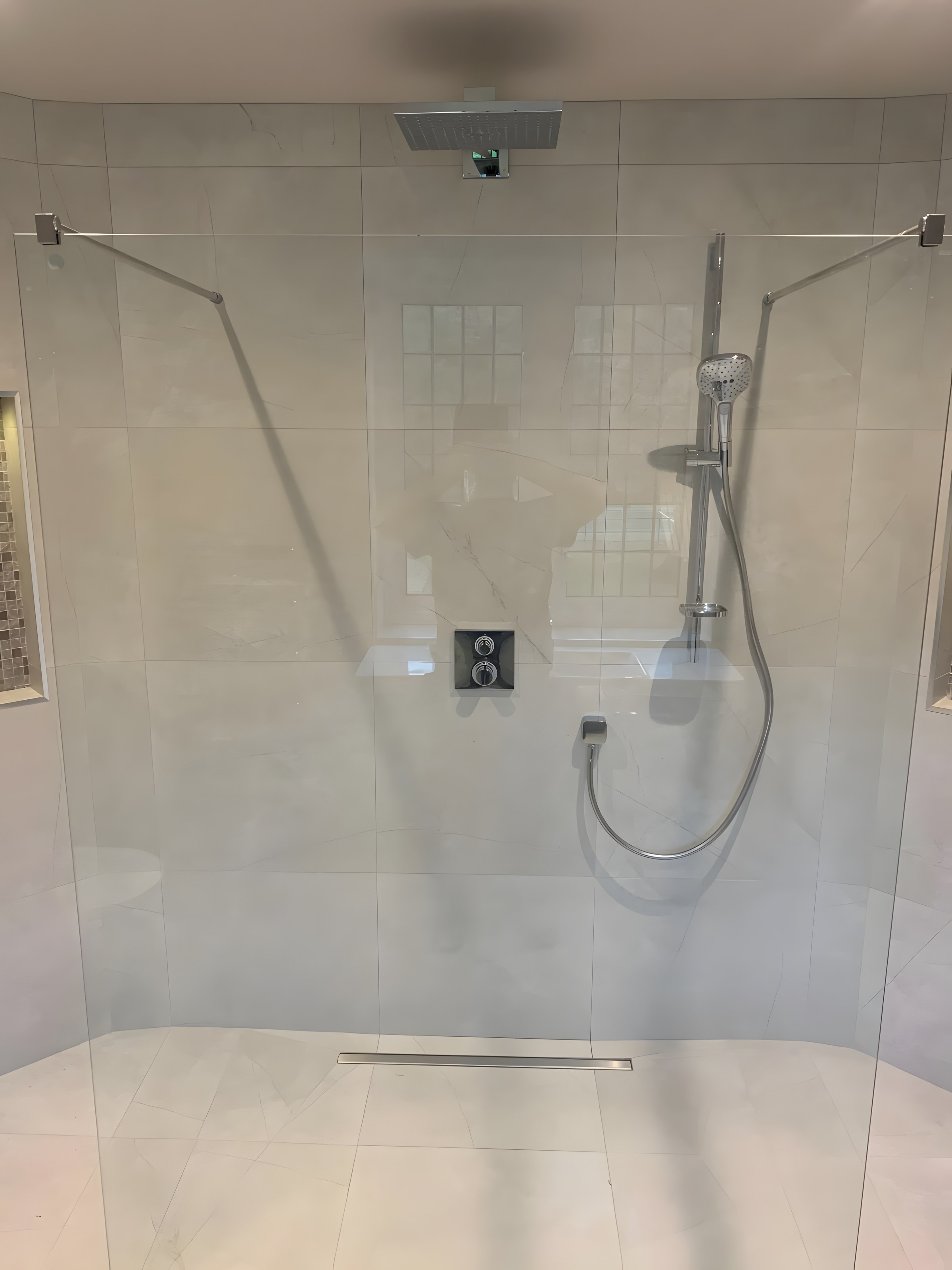 Walk-in shower with frameless glass and rainfall head